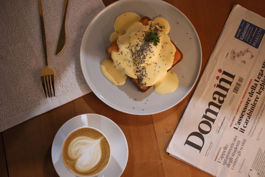 Top view of a delicious toast with creamy sauce and cappuccino, perfect for breakfast.